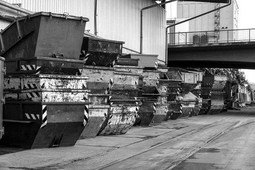 Workers and skips at a Dalston depot illustrating responsible waste management