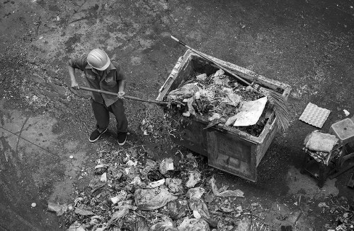 Dalston streets with a skip placed on the sidewalk