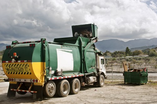 Professional team delivering a skip to a construction site