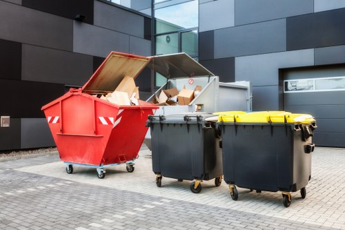Man and van workers loading furniture in a Dalston flat clear-out
